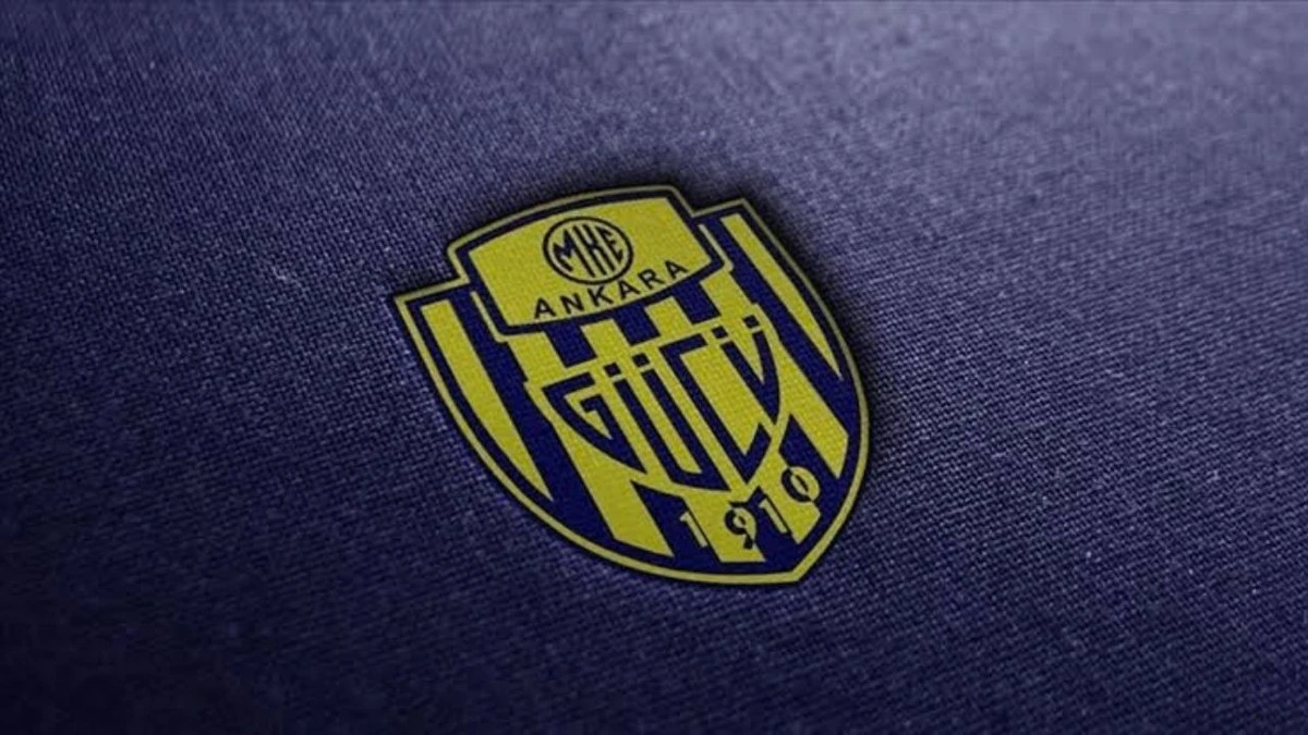 MKE Ankaragücü amblemi koyu renkli kumaş üzerinde