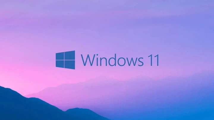 Windows 11 logosu renkli bir arka plan üzerinde